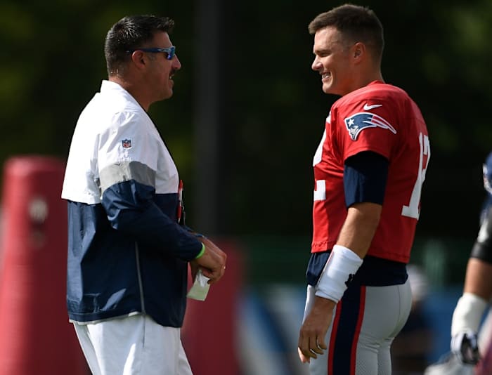 Tennessee Titans head coach Mike Vrabel chats with New England Patriots quarterback Tom Brady (12) during a joint training camp practice at Saint Thomas Sports Park Wednesday, Aug. 14, 2019 in Nashville, Tenn.